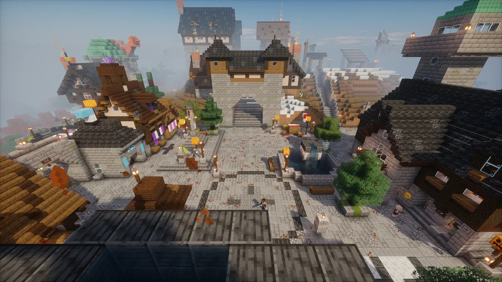 Pailhaven town square seen from above, with shops and guild buildings around it